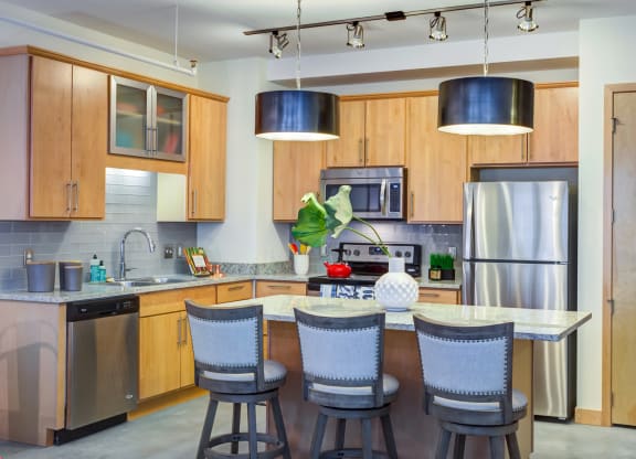 Kitchen with dinning table at Arcade Apartments, Missouri