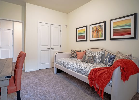 Dominium_Bren Road Station_Bedroom with wall farmes at Bren Road Station 55+ Apartments, Minnetonka, MN