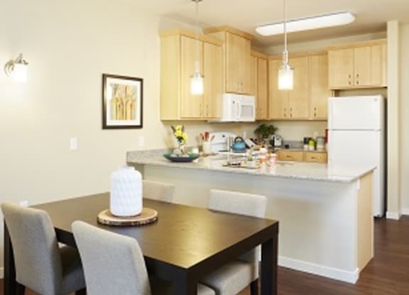 Dining Room and Kitchen at The Cambric Senior Apartments, St. Paul, MN