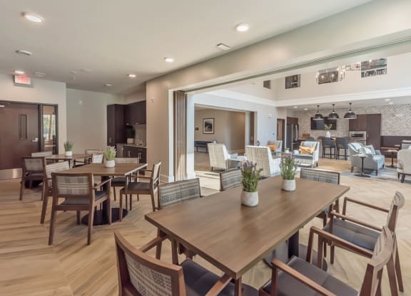 Community Room with chairs and tables at Covington Crossings 55+ Senior Living, Covington, GA, 30014