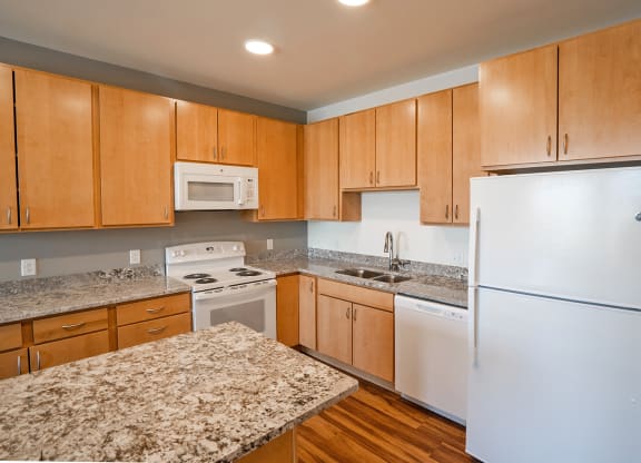 Kitchen with cabinets at Heritage at Church Ranch 55+ Apartments, Westminster , CO