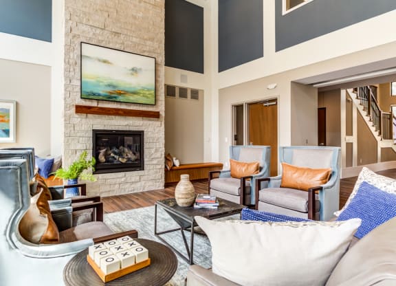 Extra Comfortable Sofa Chair In Living Room at The Legends at Berry 62+ Apartments, St. Paul, MN 55114
