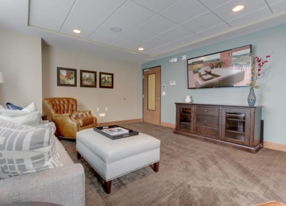 Living room with TV at The Legends at Silver Lake Village 55+ Apartments, St. Anthony, 55421