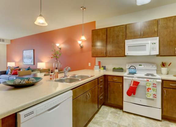 Kitchen with gas stove at The Legends at Silver Lake Village 55+ Apartments, St. Anthony, Minnesota, 55421