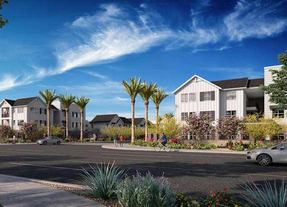 A street view of a residential area with houses and cars at Orchard Springs 55+ Apartment, Surprise, AZ, 85374