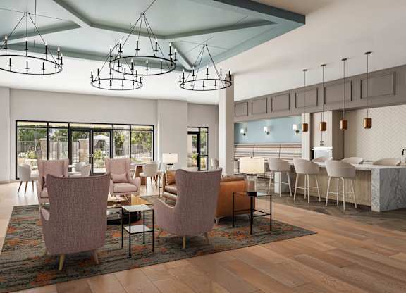 A modern dining room with a fireplace and a large table at Orchard Springs 55+ Apartment , Surprise, AZ
