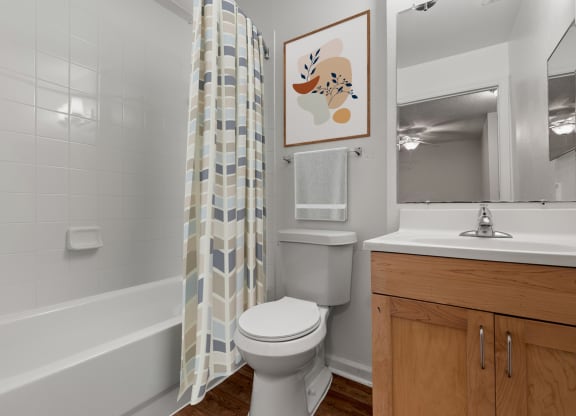 a bathroom with a toilet and a shower curtain