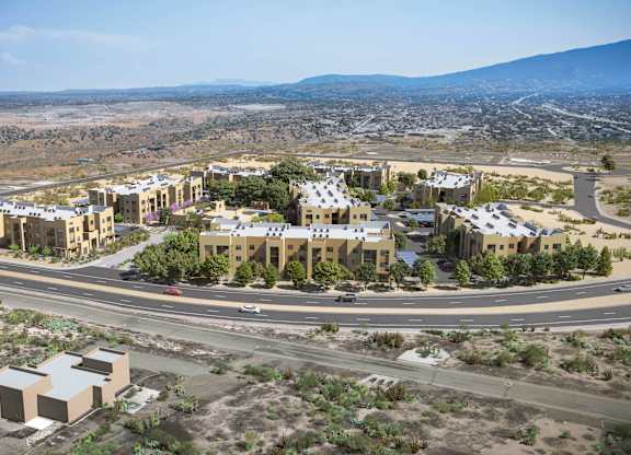 A large building complex is surrounded by roads and vegetation at Sandoval Flats Apartment, Rio Rancho, MN, 87144