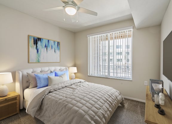 Bedroom with cozy bed at Sandpiper Glen 62+ Apartments, Orlando