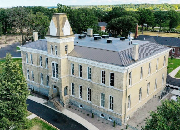 arial view of a large stone building with a towerat Upper Post Flats, Fort Snelling, MN 55111