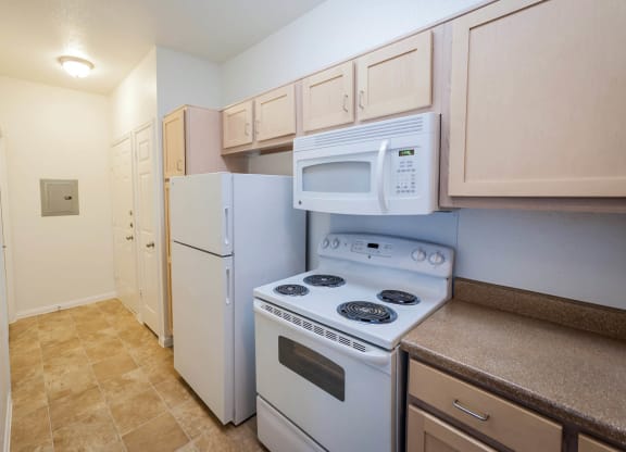 Kitchen with gas stove at Villa Springs, Houston, TX