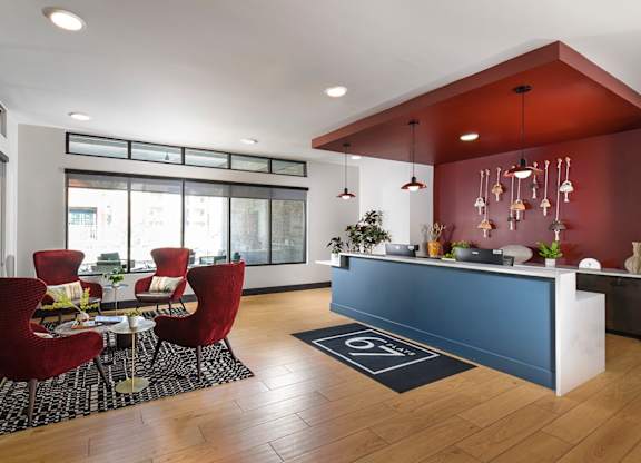 A modern living room with a dining table and chairs.