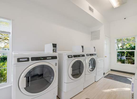 A laundry room with a washer and dryer in it.