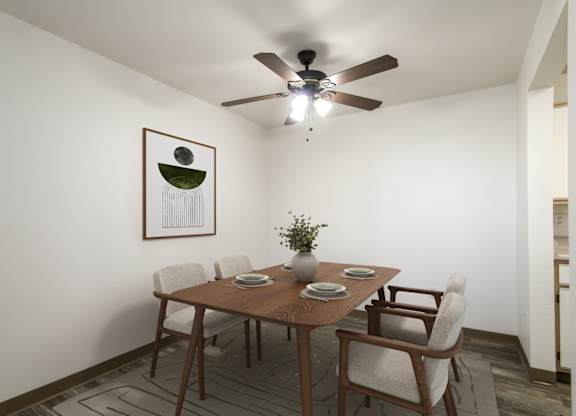 A dining room with a table set for four.