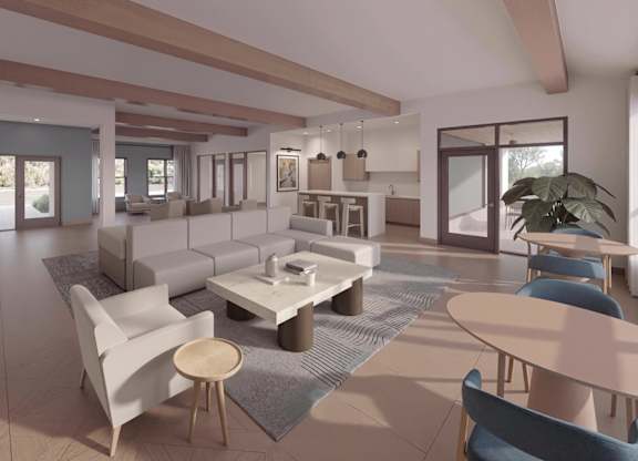 A modern living room with a white sofa set and a grey rug.