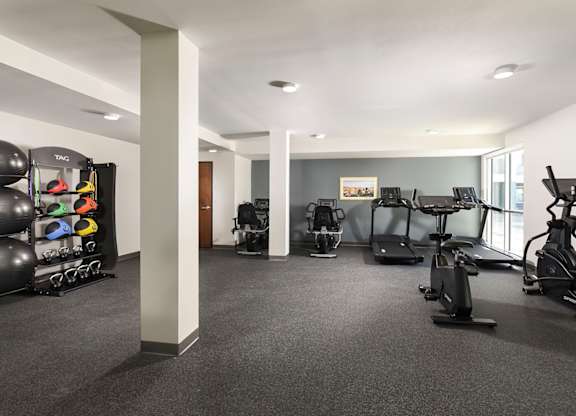 A spacious gym with a variety of exercise equipment.