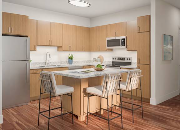 A kitchen with wooden cabinets and a white countertop at Maison at Solivita Marketplace Apartment Homes, Kissimmee, Florida