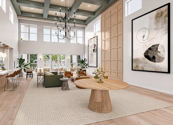A modern living room with a large wooden coffee table and a chandelier hanging from the ceiling at Maison at Solivita Marketplace Apartment Homes, Florida