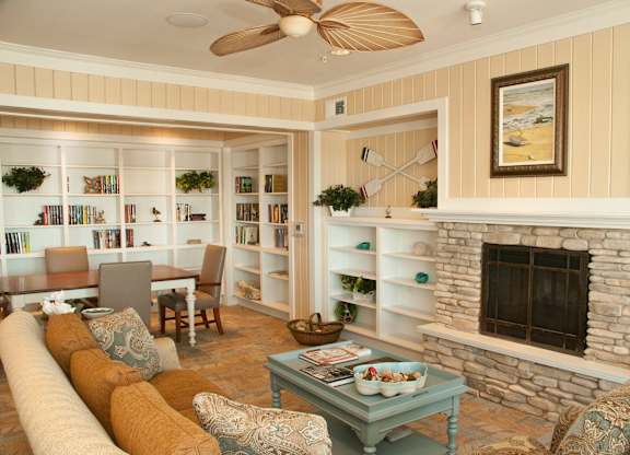 Living Room With Fireplace at Mariposa at Bay Colony, Dickinson