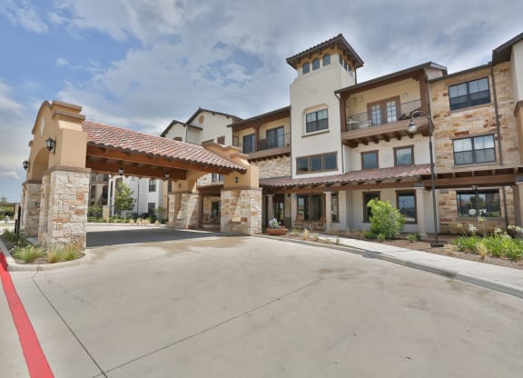 the residences at city center apartments exterior street view at Cedars of Elk Drive 55+ Apartments, Burleson, TX