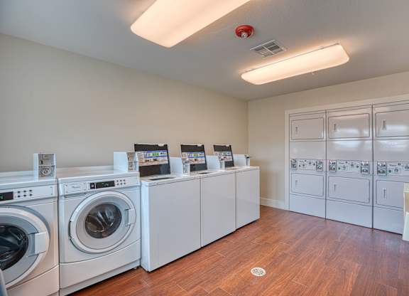 the preserve at ballantyne commons laundry room with washes and dryers at Mariposa at South Broadway, Joshua, TX