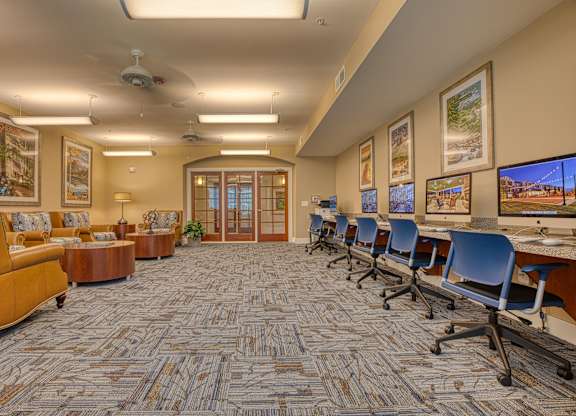 a large conference room with chairs and tables and a television at Mariposa at South Broadway, Texas, 76058
