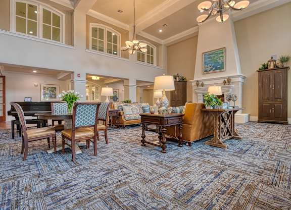 a living room with furniture and a piano at Mariposa at South Broadway, Joshua, TX