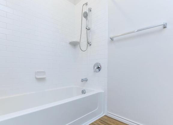 a white bathroom with a shower and a tub at Mariposa at Westchester, Grand Prairie, 75052