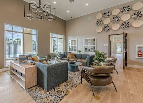 A living room with a grey couch and a wooden coffee table.