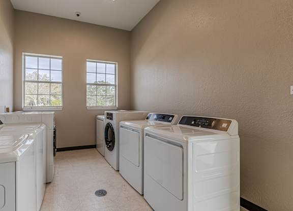 A laundry room with a washer and dryer in it.