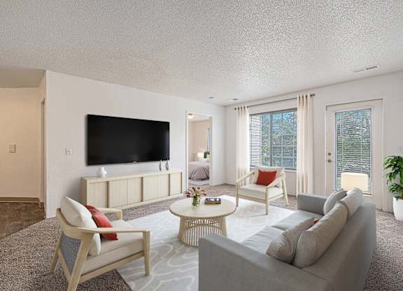 Living Area With TV at Pine Tree Apartments, Omaha, NE