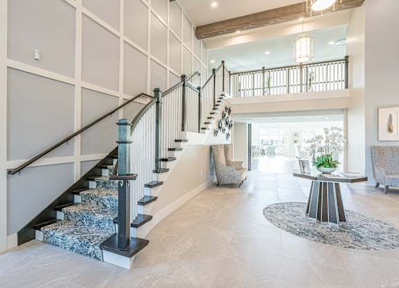 Living room and stairs at Sandpiper Glen 62+ Apartments, Orlando, Florida
