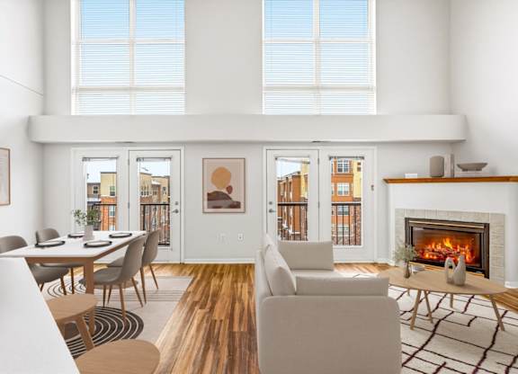 A modern living room with a fireplace and a dining table.