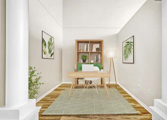 A room with a desk and a chair in the middle.