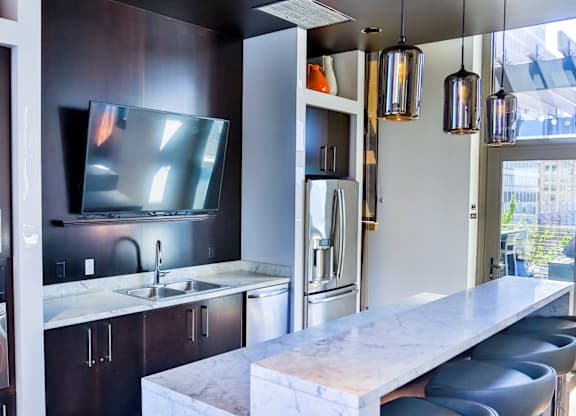 Kitchen with dark wooden cabinets at Arcade Apartments, St Louis, MO
