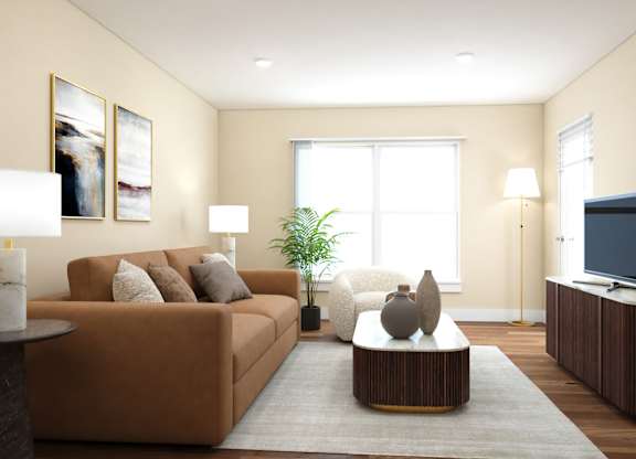 A living room with a brown couch, a coffee table, and a television.