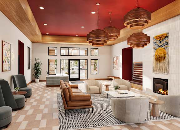A modern living room with a fireplace and comfortable seating.