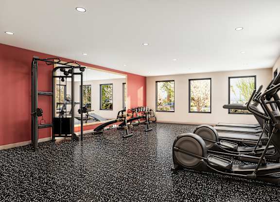 Fitness center with cardio equipment and strength machines at Turquoise Trail Apartments, Santa Fe, New Mexico