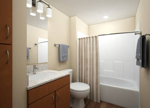 Bathroom with wood vanity and white fixtures at Turquoise Trail Apartments, Santa Fe