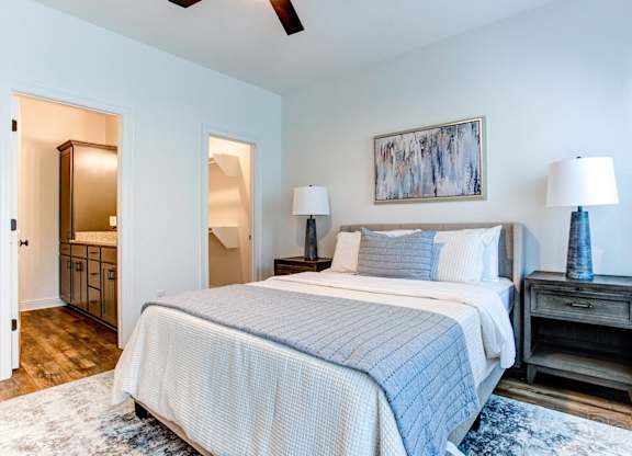 a bedroom with a bed and a closet