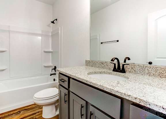a bathroom with a sink and a toilet