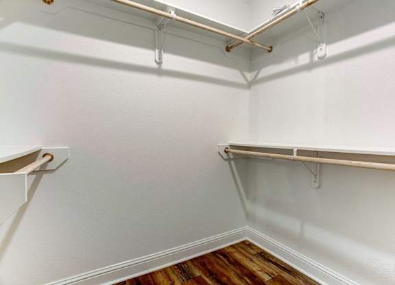 the preserve at ballantyne commons empty walk in closet with white walls and shelves