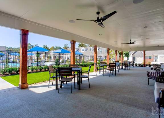 the clubhouse patio at the crossings at white marsh apartments
