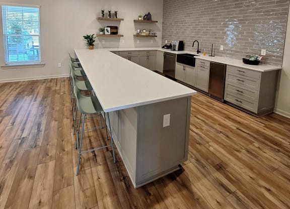a view from above of a living room with a kitchen and a ceiling with wood