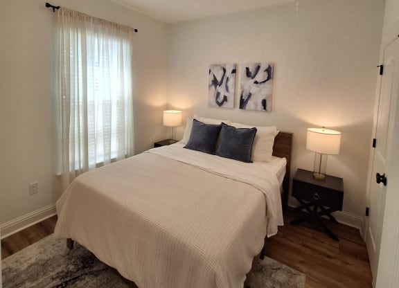 a bedroom with a bunk bed and a staircase with a window