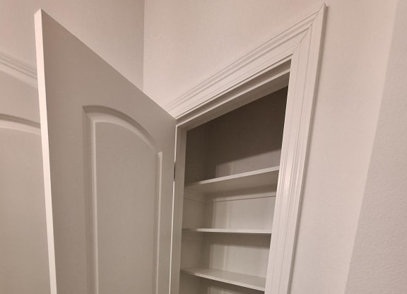 the ceilings in the living room are painted white and the floors are wood
