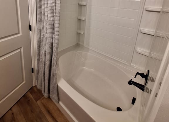 a small bathroom with a toilet and a walk in shower