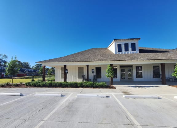a building with a parking lot in front of it