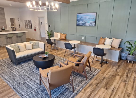 a living room with a couch and chairs
