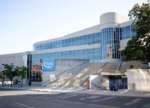 George's building with a blue sign on it.